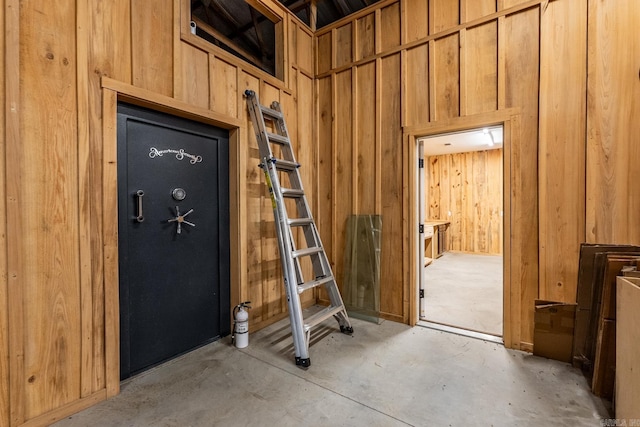 miscellaneous room with wooden walls