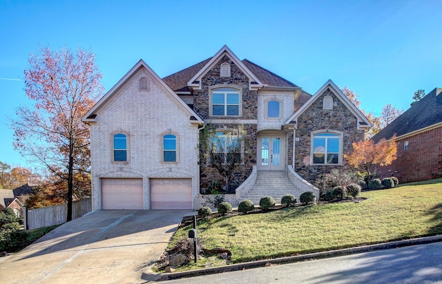 view of front facade featuring a front lawn and a garage