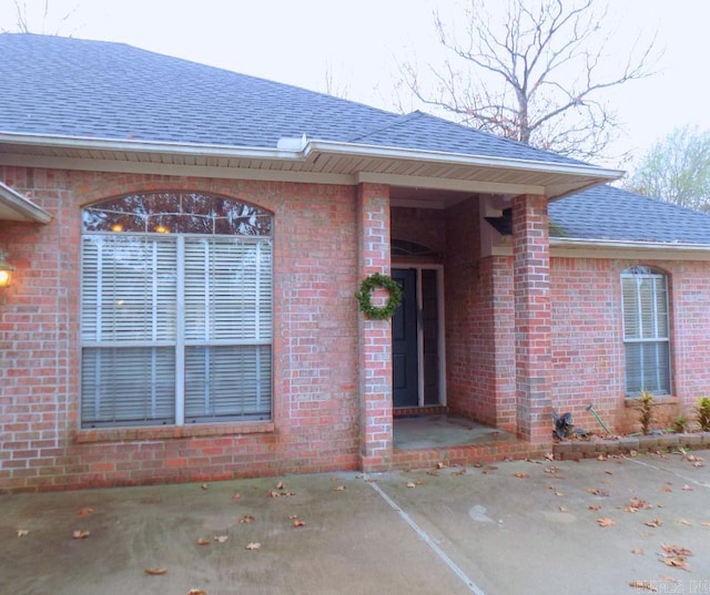 property entrance with a patio area