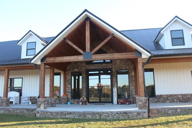 back of house with french doors and covered porch