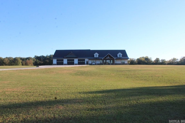 new england style home with a rural view and a front lawn