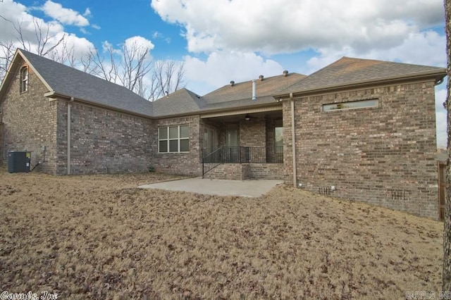 rear view of property with a patio and central air condition unit