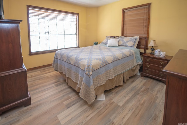 bedroom with hardwood / wood-style floors