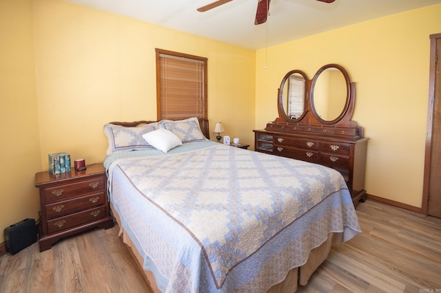 bedroom featuring ceiling fan and light hardwood / wood-style floors