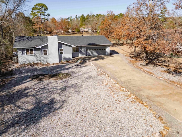 single story home featuring a garage