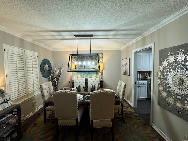 dining room with a textured ceiling, an inviting chandelier, and ornamental molding