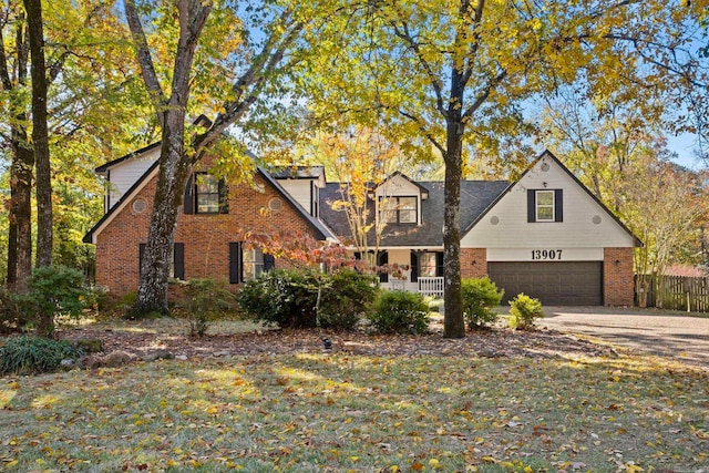 view of front of house featuring a front yard and a garage