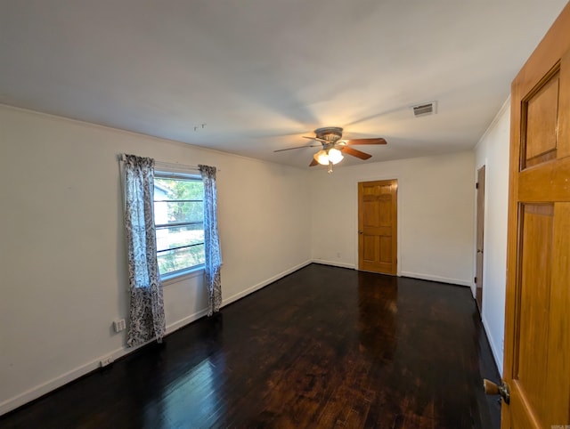 unfurnished room featuring ceiling fan and dark wood-type flooring