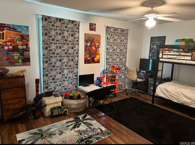 bedroom featuring ceiling fan, a textured ceiling, and hardwood / wood-style floors