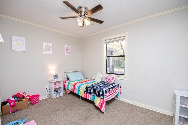 carpeted bedroom featuring ceiling fan and crown molding