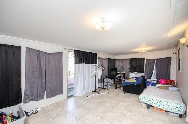 bedroom featuring cooling unit and light tile patterned floors