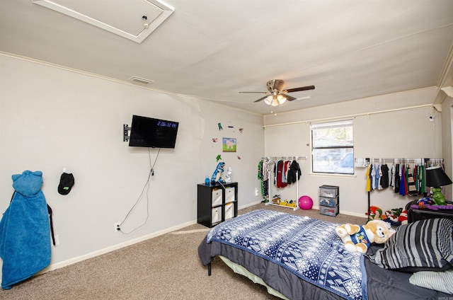 carpeted bedroom featuring ceiling fan and ornamental molding