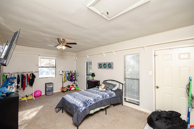 carpeted bedroom featuring ceiling fan