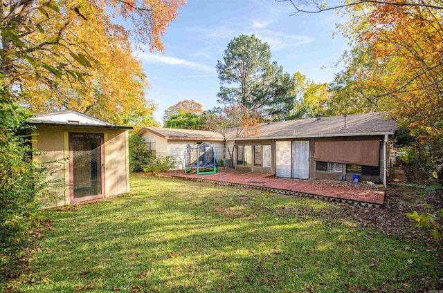 view of yard with a trampoline