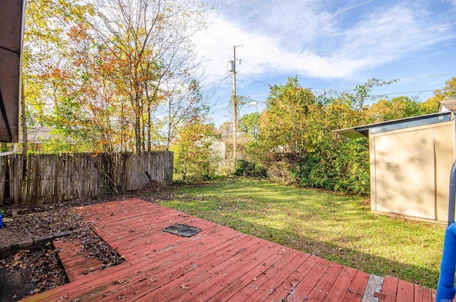 wooden deck with a lawn