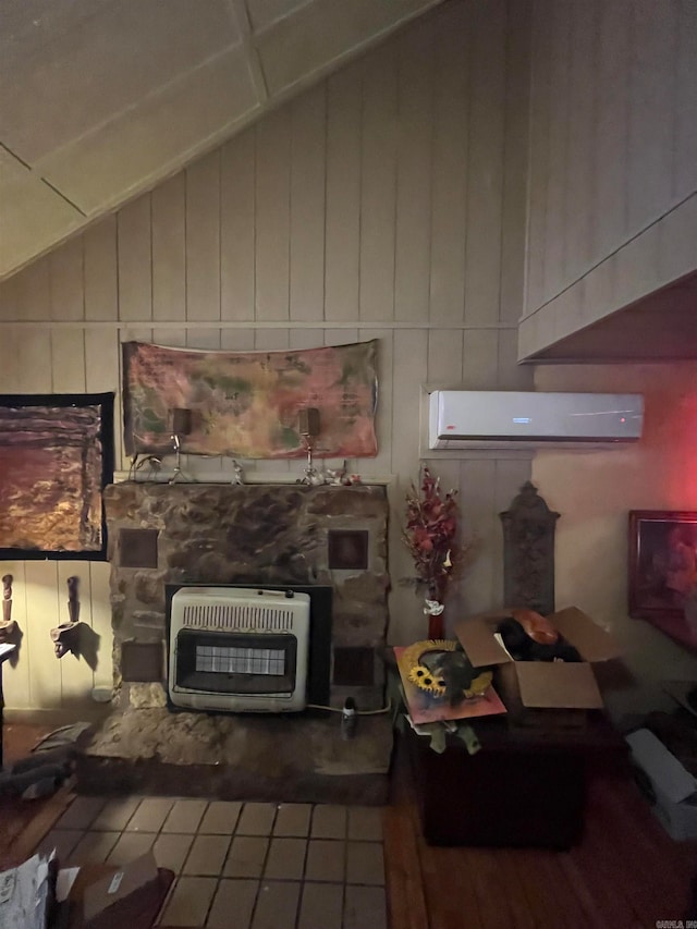 living room with heating unit, a wall mounted AC, and lofted ceiling