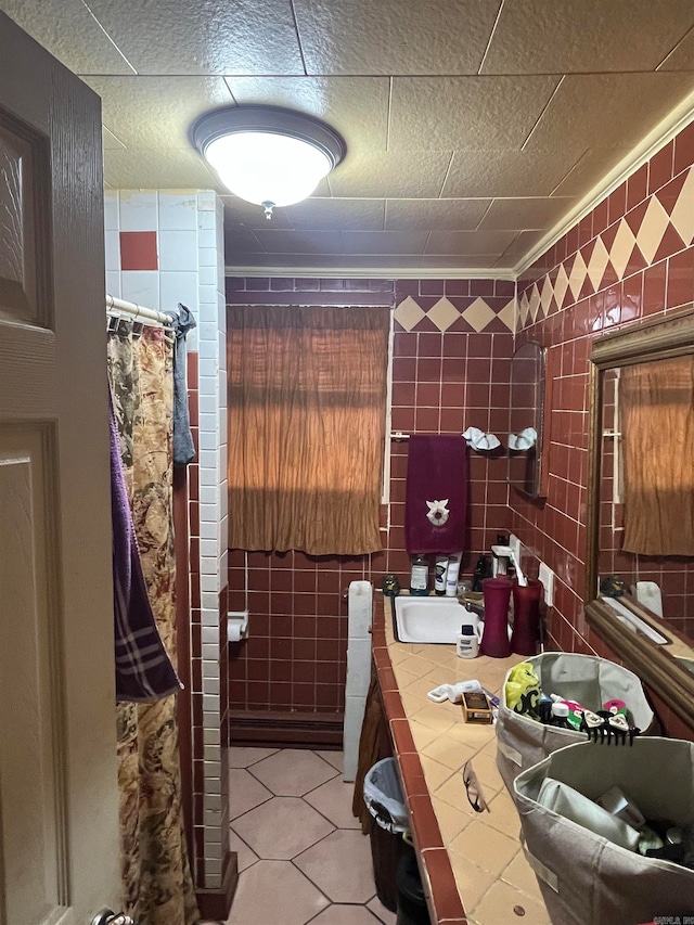 bathroom with tile walls and sink