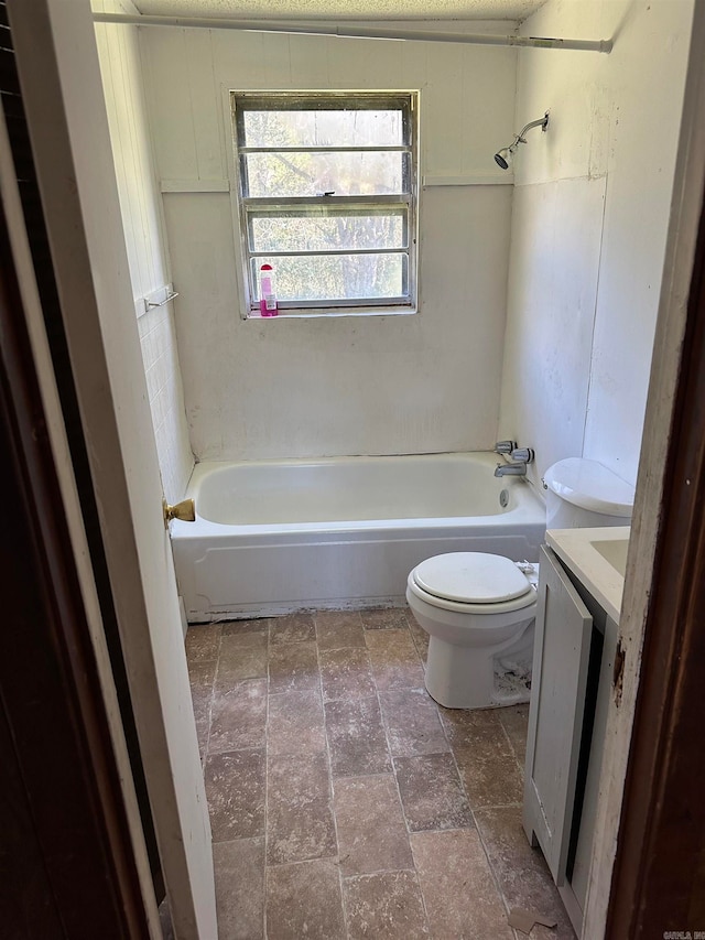 full bathroom featuring shower / tub combination, vanity, a textured ceiling, and toilet