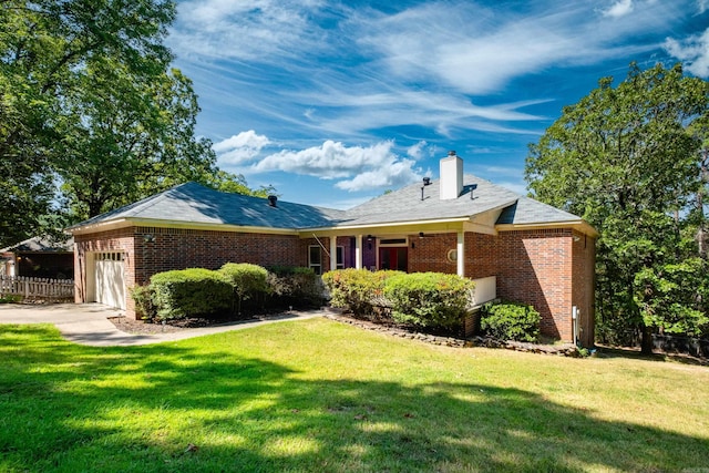 ranch-style home with a garage and a front yard