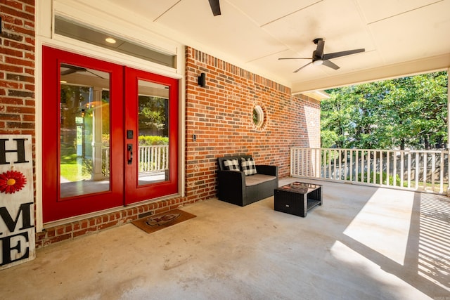 view of patio / terrace featuring ceiling fan, a porch, and french doors