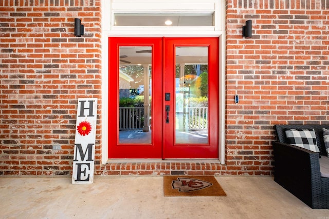 view of exterior entry featuring french doors