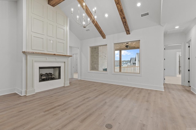 unfurnished living room featuring beamed ceiling, a notable chandelier, light hardwood / wood-style floors, and high vaulted ceiling