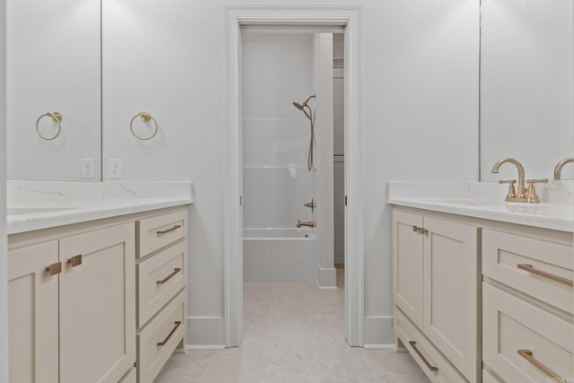 bathroom featuring tile patterned floors, vanity, and washtub / shower combination