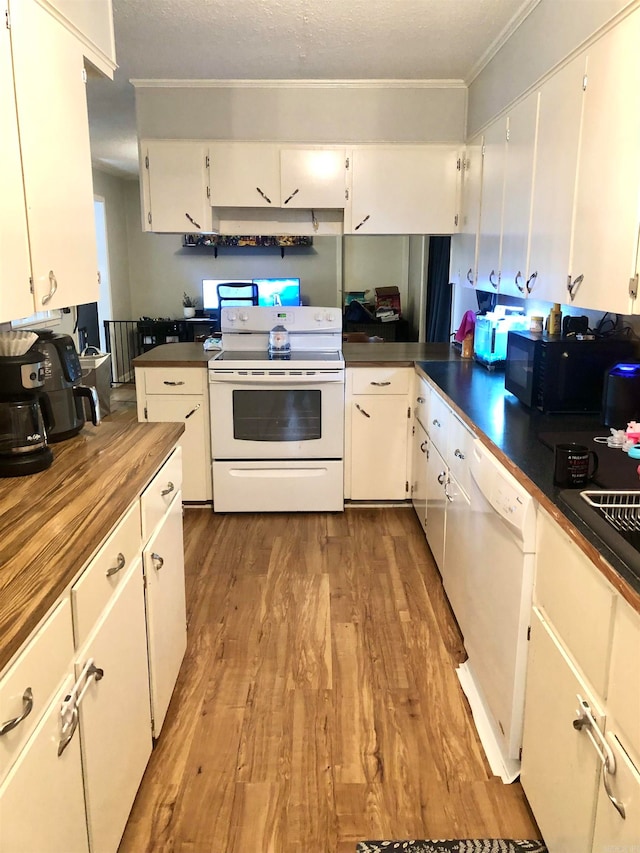 kitchen with white cabinetry, crown molding, light hardwood / wood-style floors, a textured ceiling, and white appliances