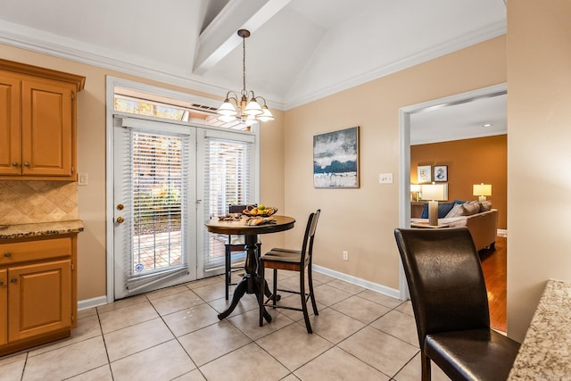 dining space featuring lofted ceiling with beams, light tile patterned flooring, crown molding, and a chandelier