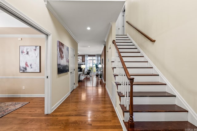 interior space featuring hardwood / wood-style floors and crown molding