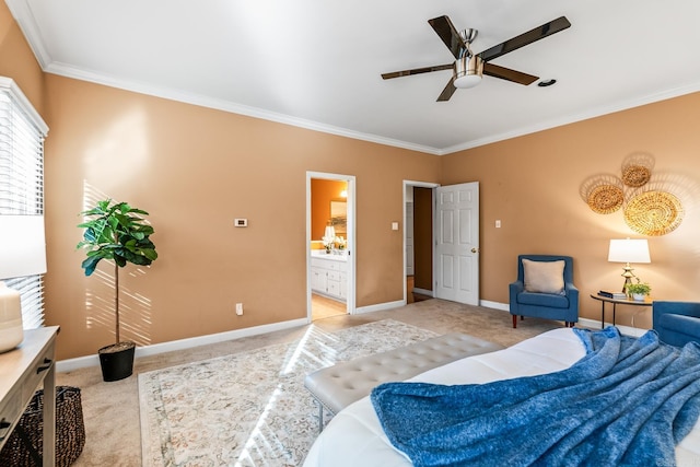 carpeted bedroom with ceiling fan, crown molding, and ensuite bathroom