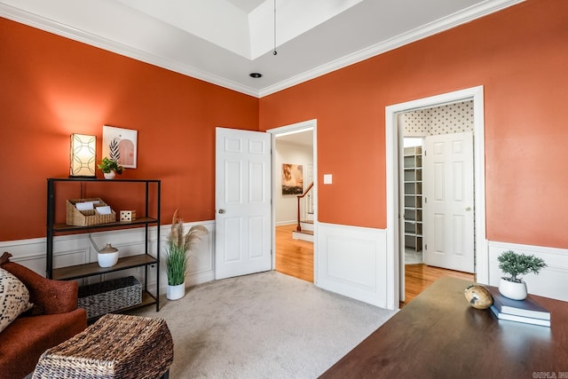 sitting room with light colored carpet and crown molding