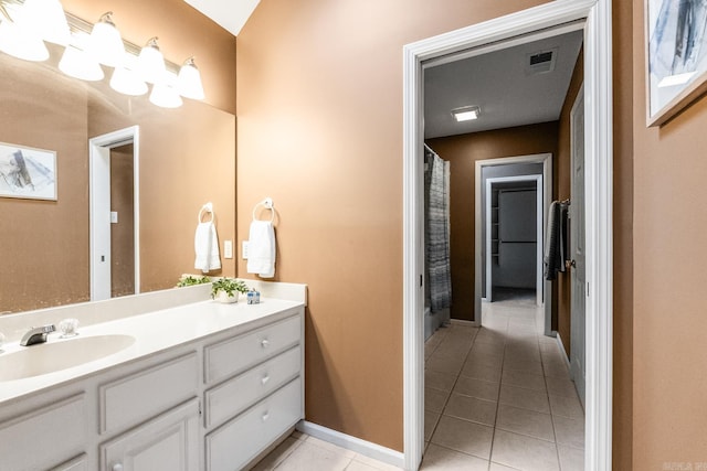 bathroom featuring tile patterned floors and vanity