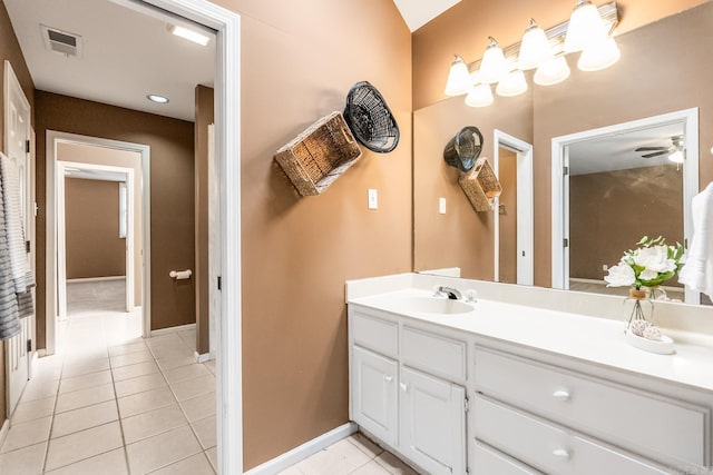 bathroom featuring tile patterned flooring, vanity, and ceiling fan