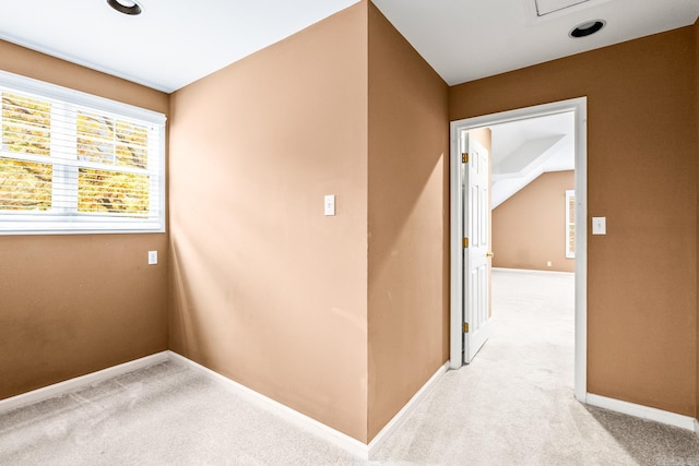 corridor with light colored carpet