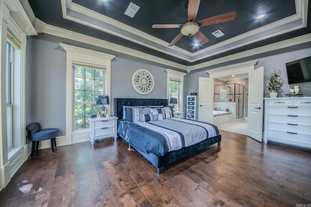 bedroom featuring dark hardwood / wood-style flooring, a tray ceiling, ceiling fan, and ornamental molding