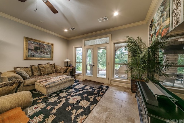 living room with crown molding, french doors, and ceiling fan