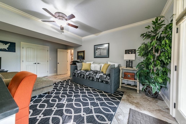 living room with ceiling fan and crown molding