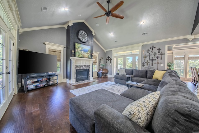 living room with a wealth of natural light, crown molding, and dark wood-type flooring