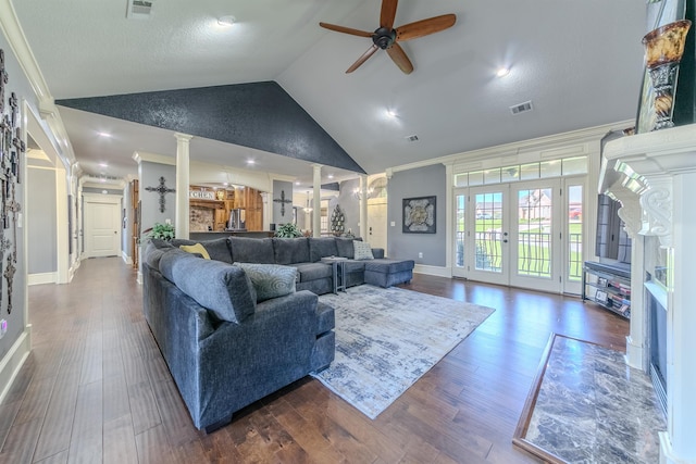 living room featuring ornate columns, ceiling fan, dark hardwood / wood-style floors, and ornamental molding