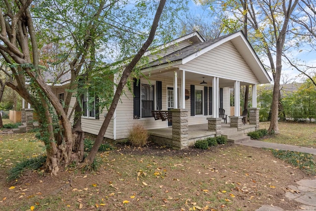 craftsman inspired home featuring ceiling fan and covered porch