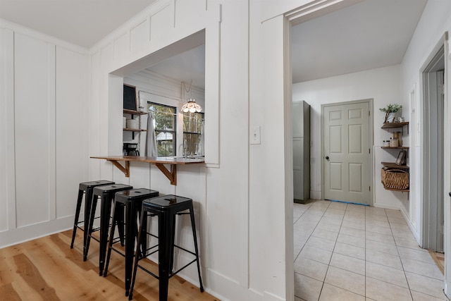 hall with light hardwood / wood-style flooring