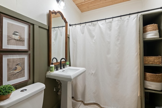 bathroom featuring toilet and wood ceiling