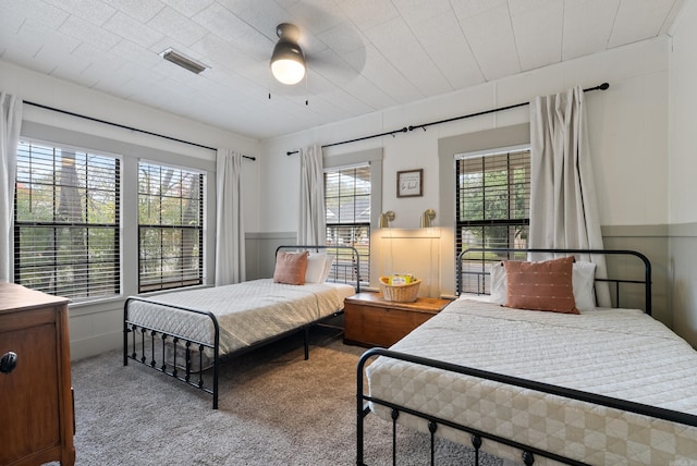 bedroom featuring ceiling fan and light colored carpet