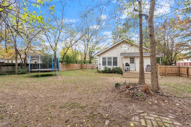 view of yard with a trampoline