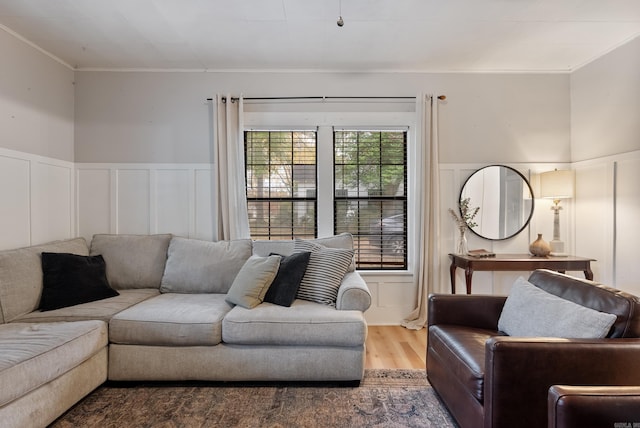 living room featuring crown molding and wood-type flooring