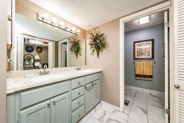 bathroom featuring vanity and a textured ceiling