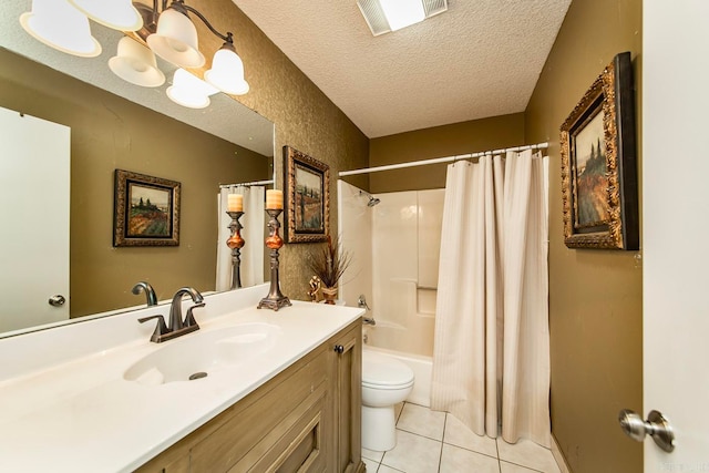 full bathroom featuring tile patterned floors, a textured ceiling, toilet, shower / bath combo with shower curtain, and vanity