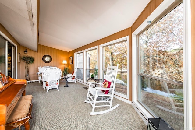 sunroom featuring lofted ceiling