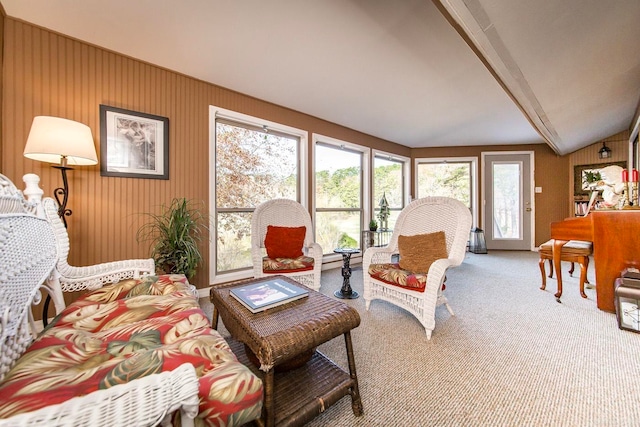 carpeted living room with lofted ceiling with beams